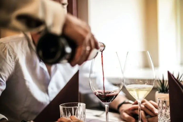 waiter pouring wine - Serrato's Steakhouse, Fine Dining in Franklin